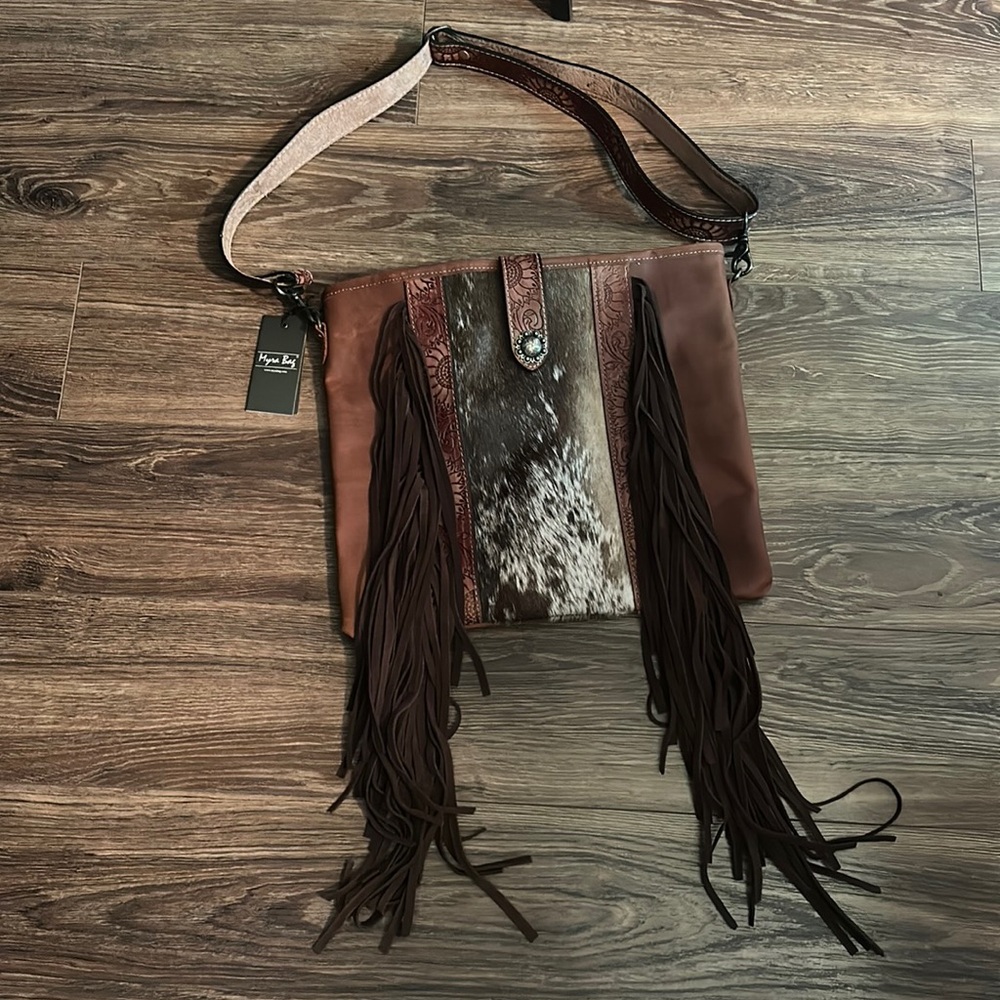 Myra Bag. Brand new never used. Still has tags on it. Smoke-free pet free home.
